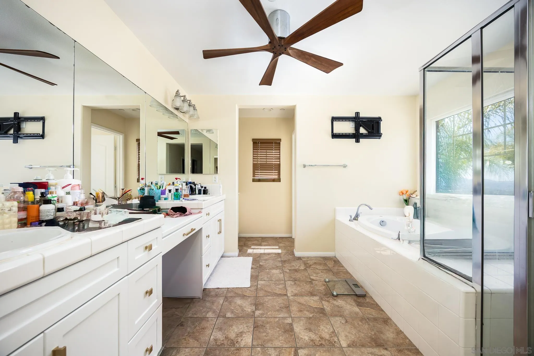 5120 Sevilla Street Santee, CA 92071 - Photo 25 of 44 a spacious bathroom with a tub sink and mirror