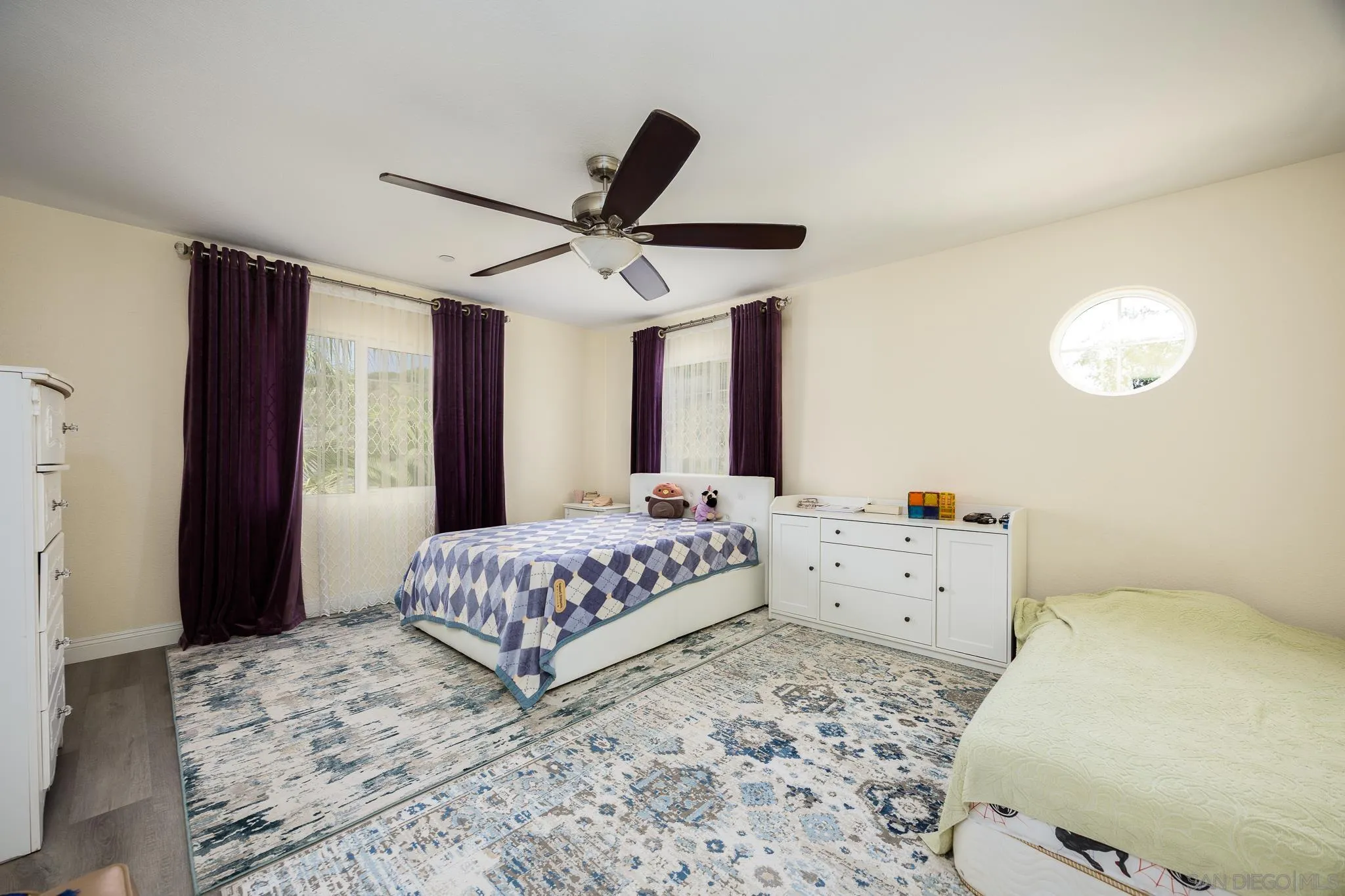 5120 Sevilla Street Santee, CA 92071 - Photo 26 of 44 a bedroom with a bed and a window