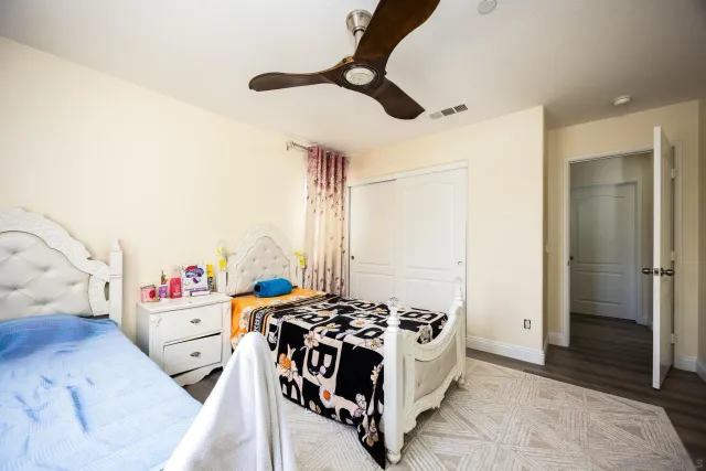 a bathroom with a sink a toilet and shower curtain