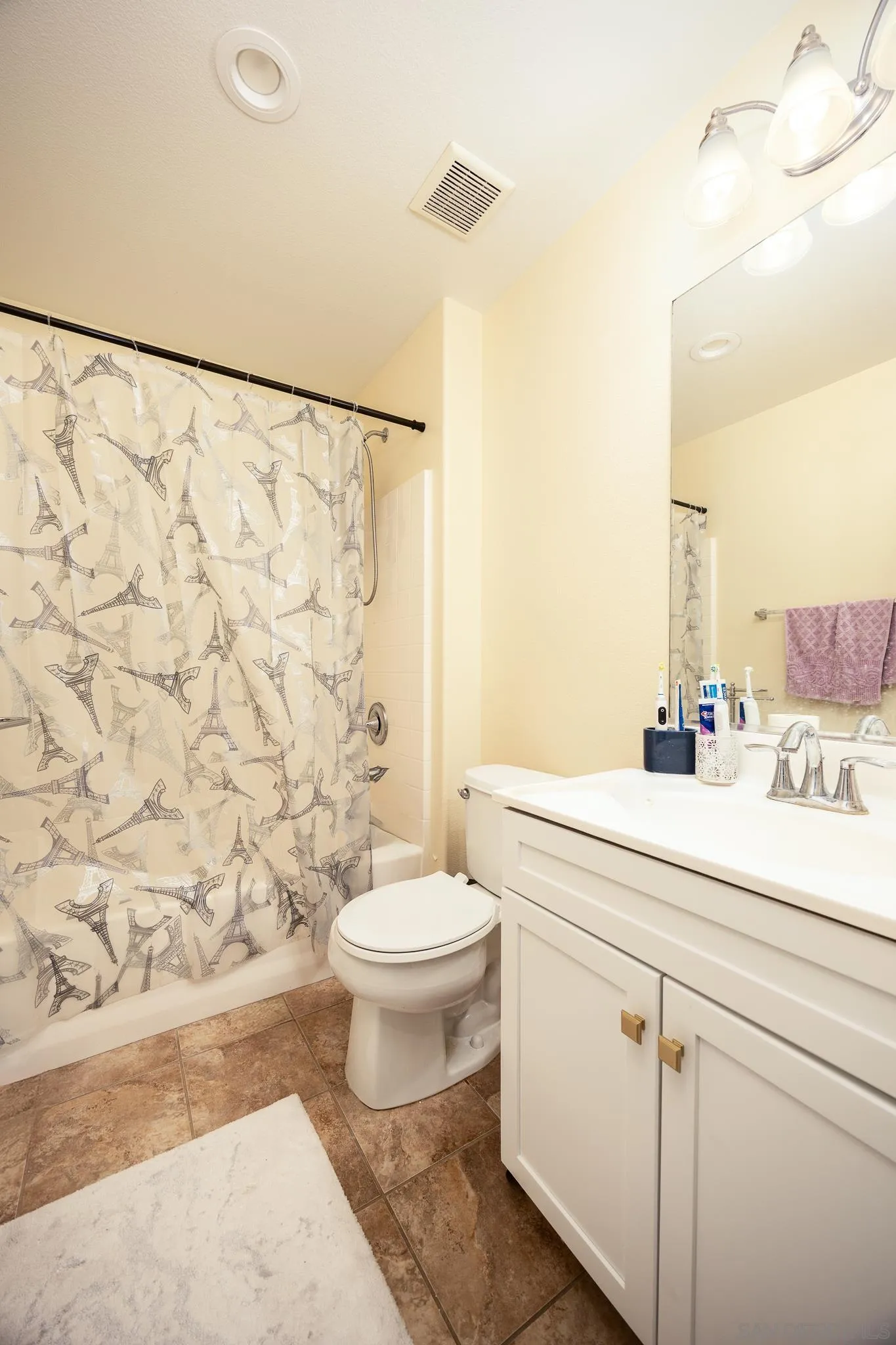 5120 Sevilla Street Santee, CA 92071 - Photo 30 of 44 a bathroom with a sink a toilet and shower curtain