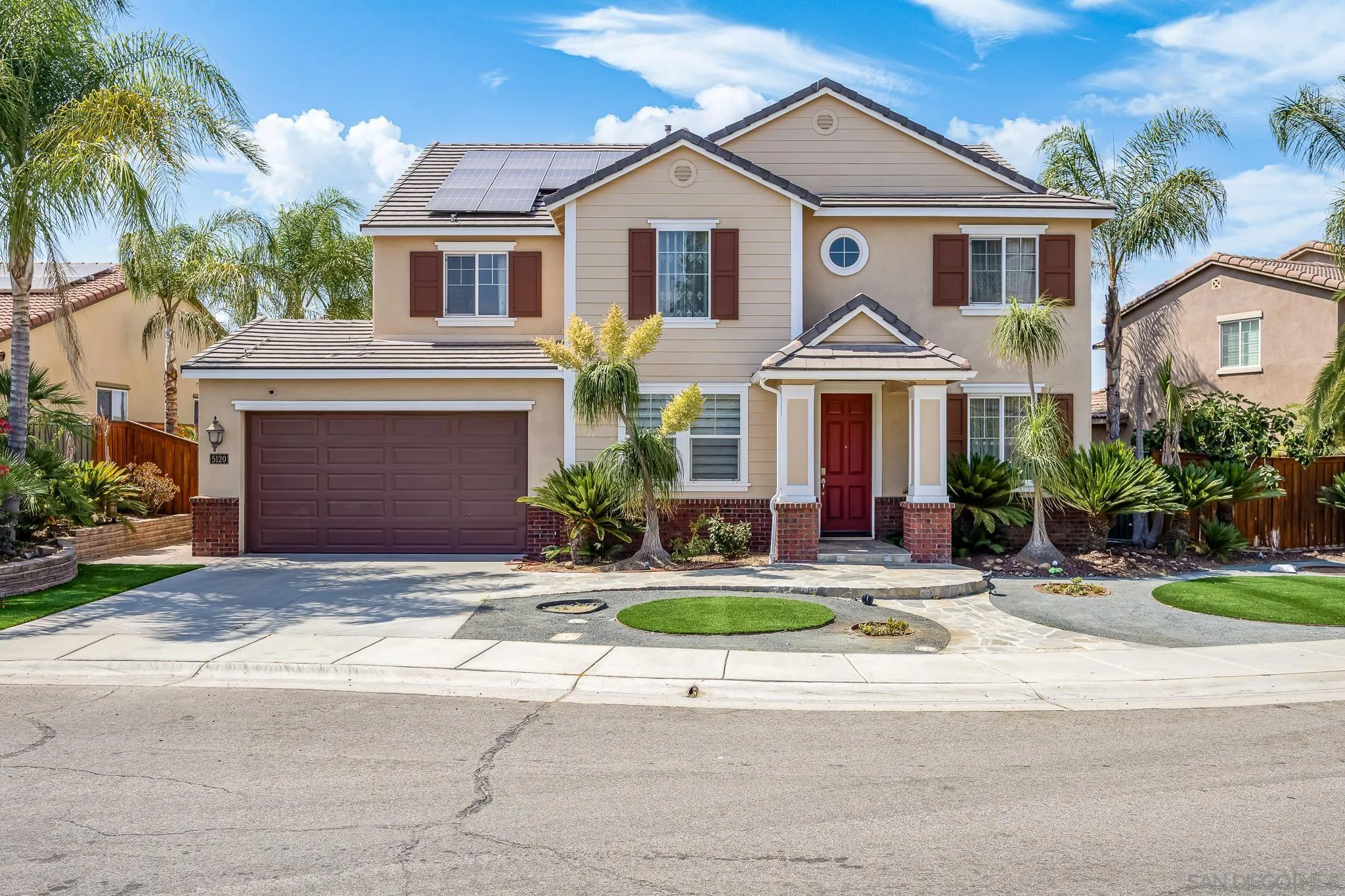 5120 Sevilla Street Santee, CA 92071 - Photo 3 of 44 a front view of a house with yard and a garage