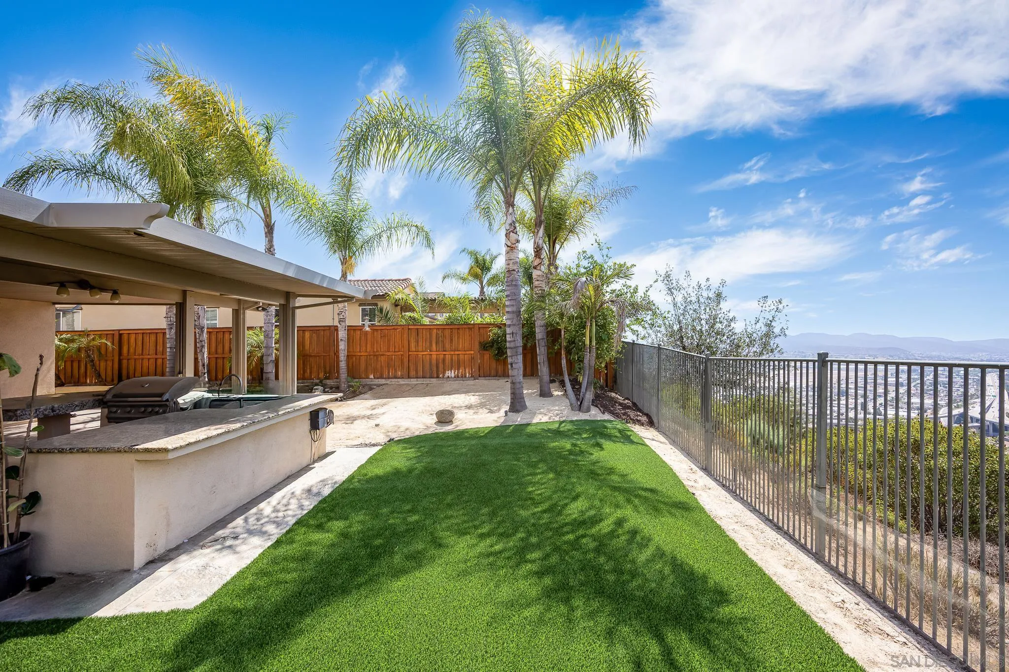 5120 Sevilla Street Santee, CA 92071 - Photo 34 of 44 a view of a backyard with swimming pool