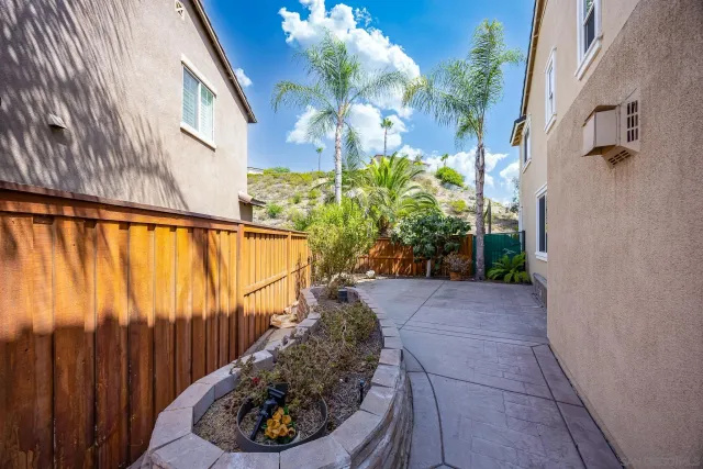 a view of a house with a yard and garage