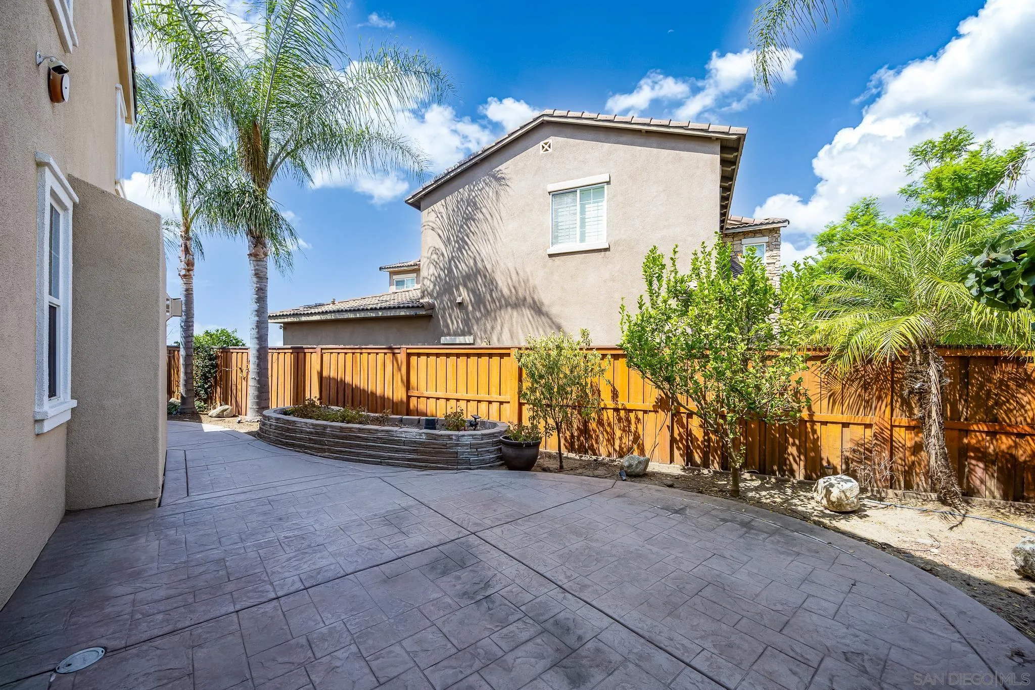 5120 Sevilla Street Santee, CA 92071 - Photo 39 of 44 a view of a house with a yard and garage