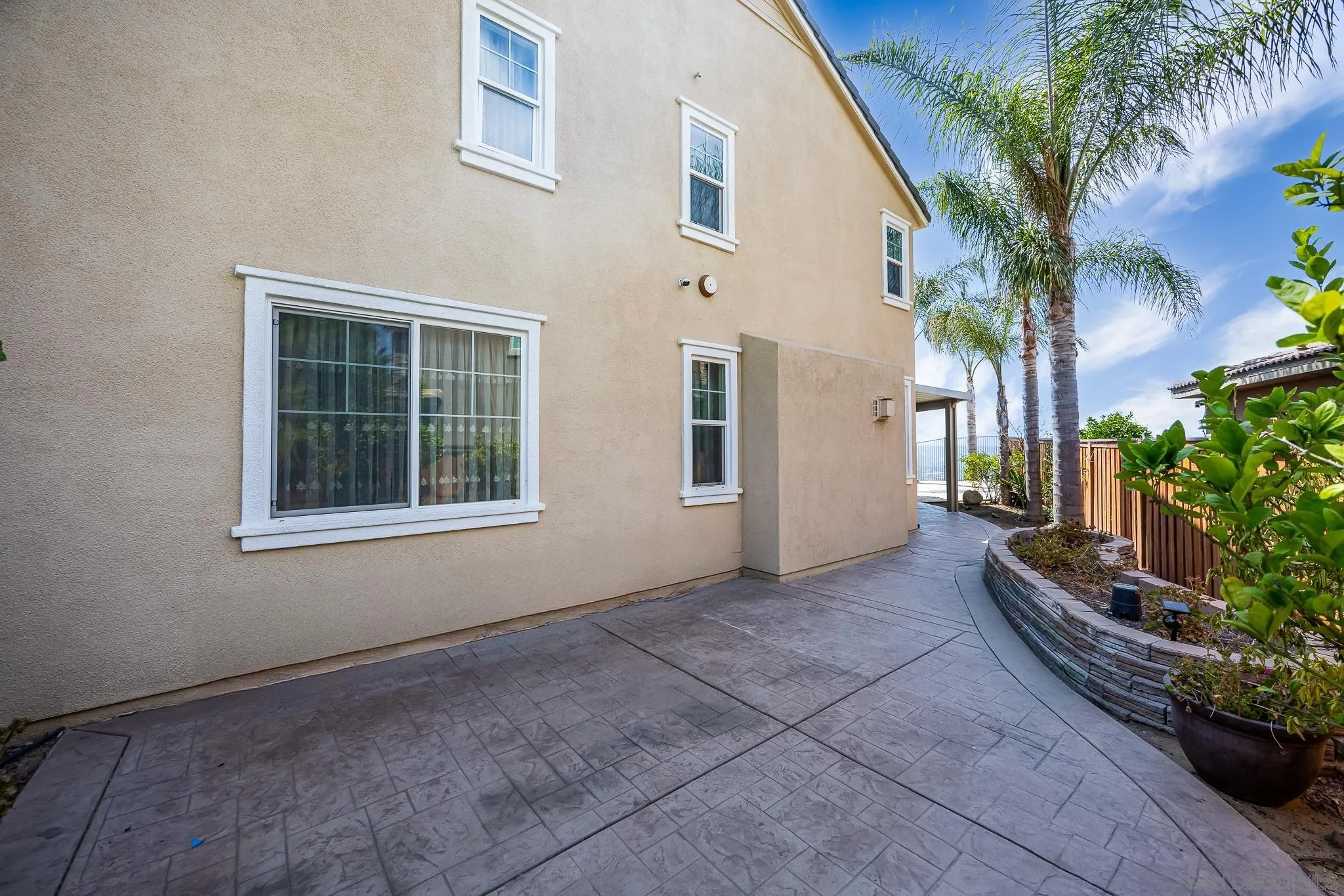 5120 Sevilla Street Santee, CA 92071 - Photo 40 of 44 a view of house with backyard and glass windows
