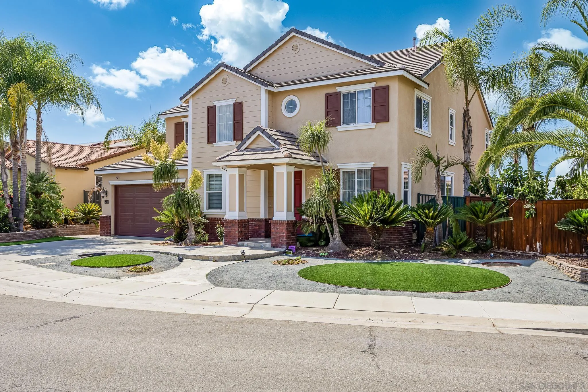 5120 Sevilla Street Santee, CA 92071 - Photo 41 of 44 a front view of a house with a yard and potted plants