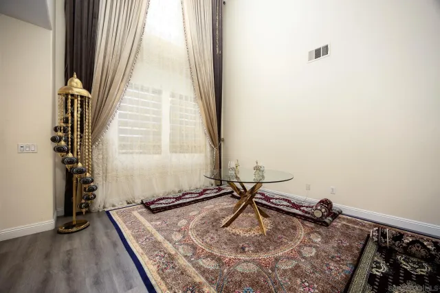 a bathroom with a tub sink and a mirror