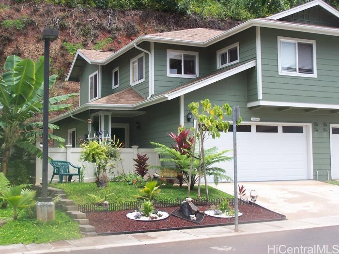 95-1363 Wikao Street, Unit 41 Mililani, HI 96789 - Photo 1 of 1 a front view of a house with a yard and potted plants