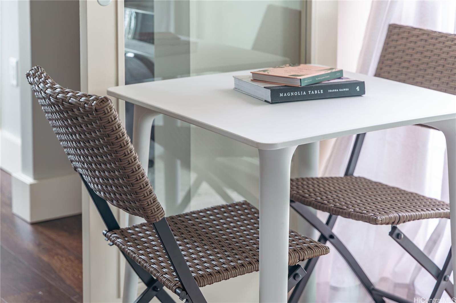 803 Waimanu Street, Unit 512 Honolulu, HI 96813 - Photo 11 of 18 a living room with furniture and wooden floor