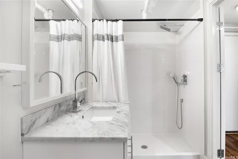a bathroom with a sink and a shower