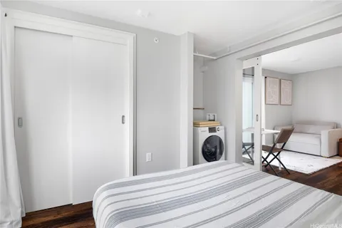 a bedroom with a bed and a chair