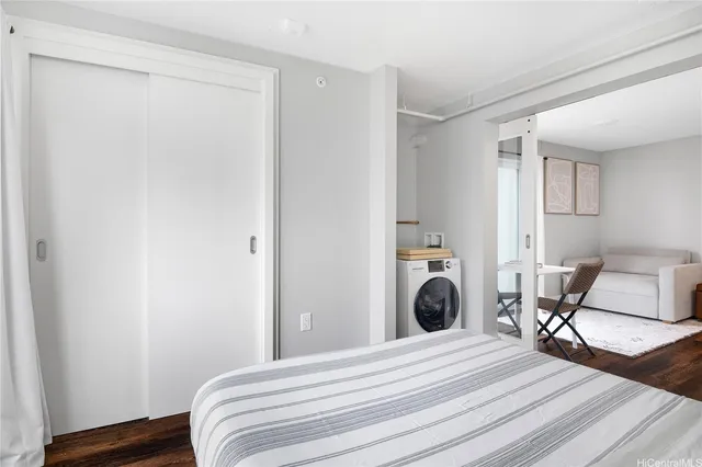 a bedroom with a bed and a chair