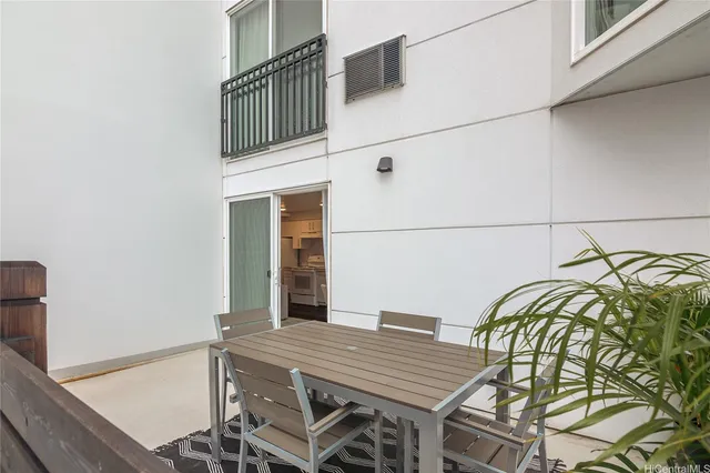 a backyard of a house with seating space