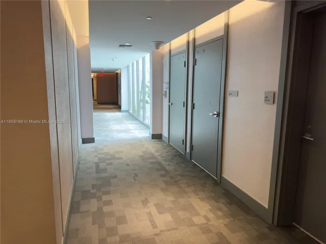 a view of a garage with cars