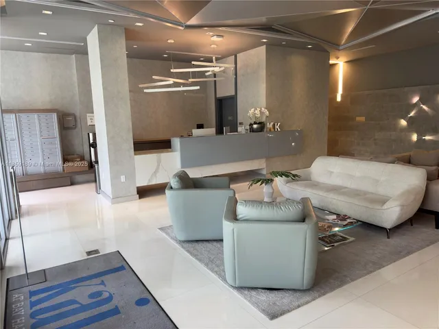 a workspace with furniture and a bathroom