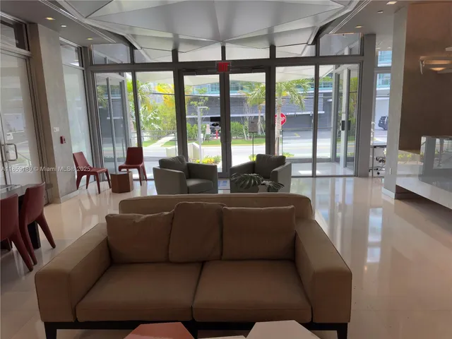 a view of a backyard with sitting area