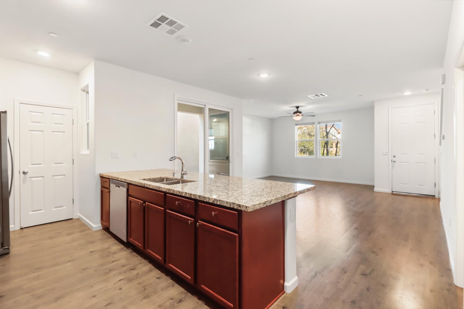 3230 Chelmer Way Rancho Cordova, CA 95670 - Photo 15 of 50 a kitchen with granite countertop a sink and cabinets