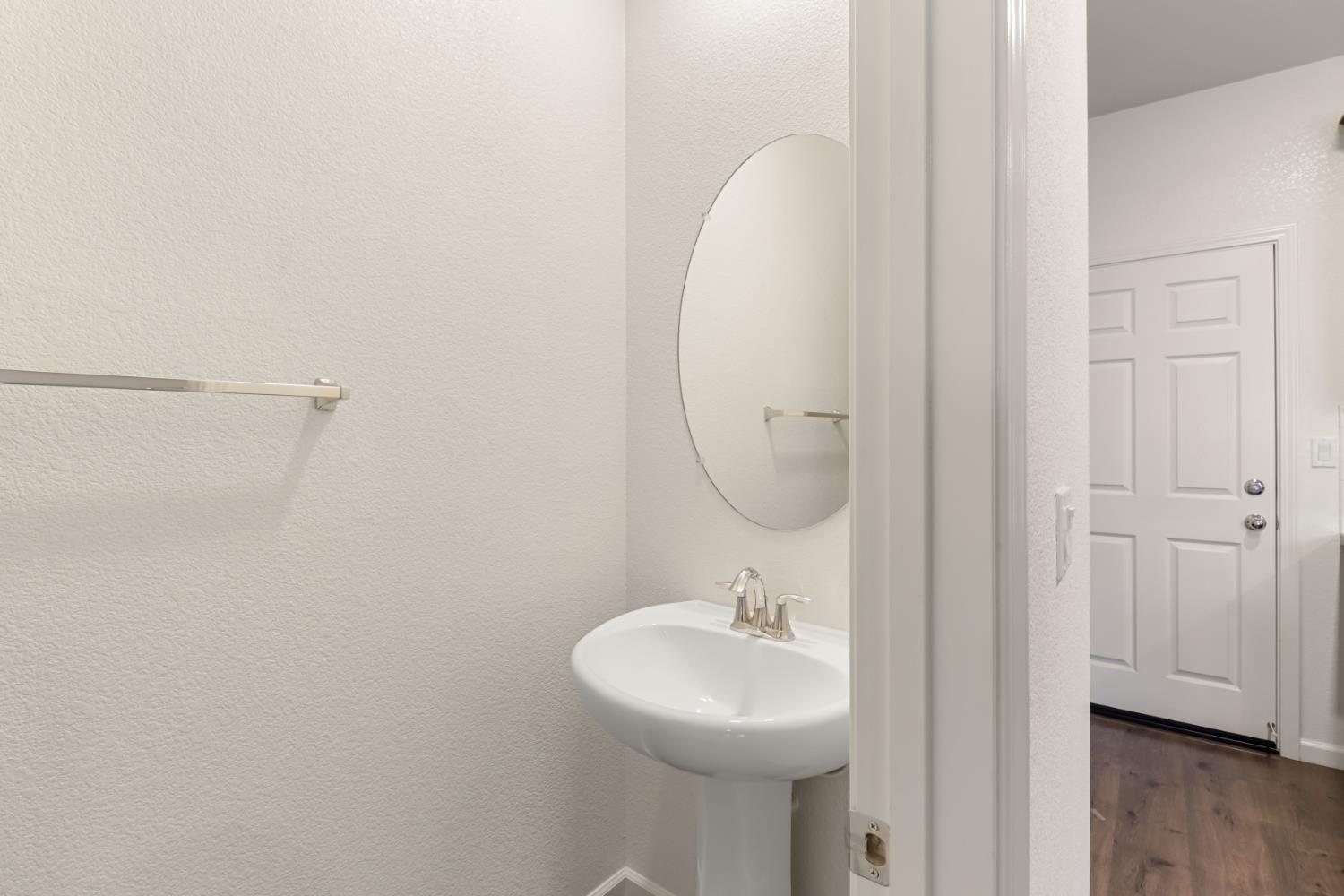 3230 Chelmer Way Rancho Cordova, CA 95670 - Photo 33 of 50 a bathroom with a sink a toilet and a mirror