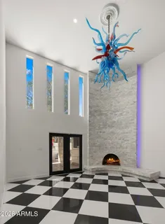 a room with a black white checkered floor with a black white checkered floor