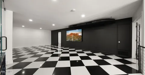 a room with pool table and flat screen tv