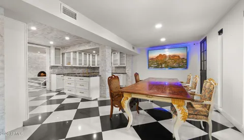 a kitchen with refrigerator and cabinets