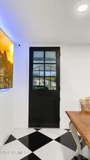 a kitchen with stainless steel appliances granite countertop a sink refrigerator and cabinets