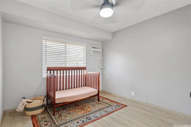 a view of a room with wooden floor and windows