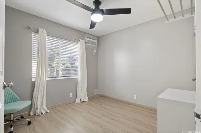 a view of an empty room with a window