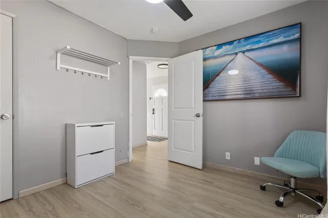 a view of room with window and wooden floor