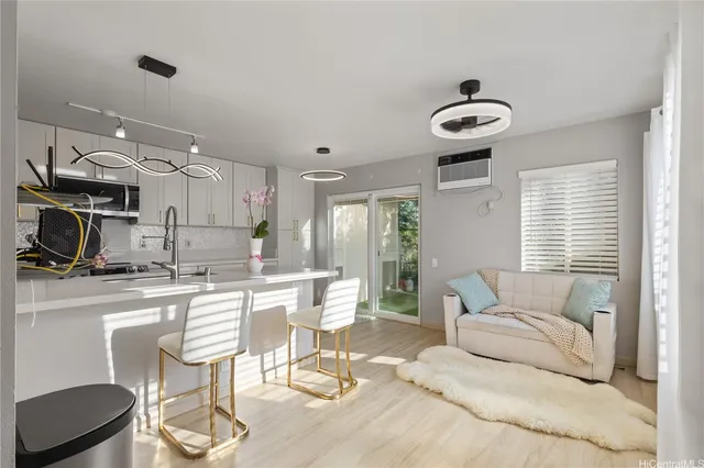 a kitchen with a table and chairs