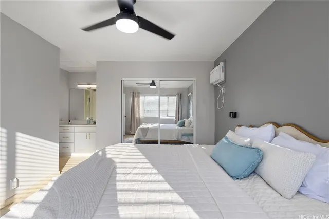 a bedroom with a bed and window