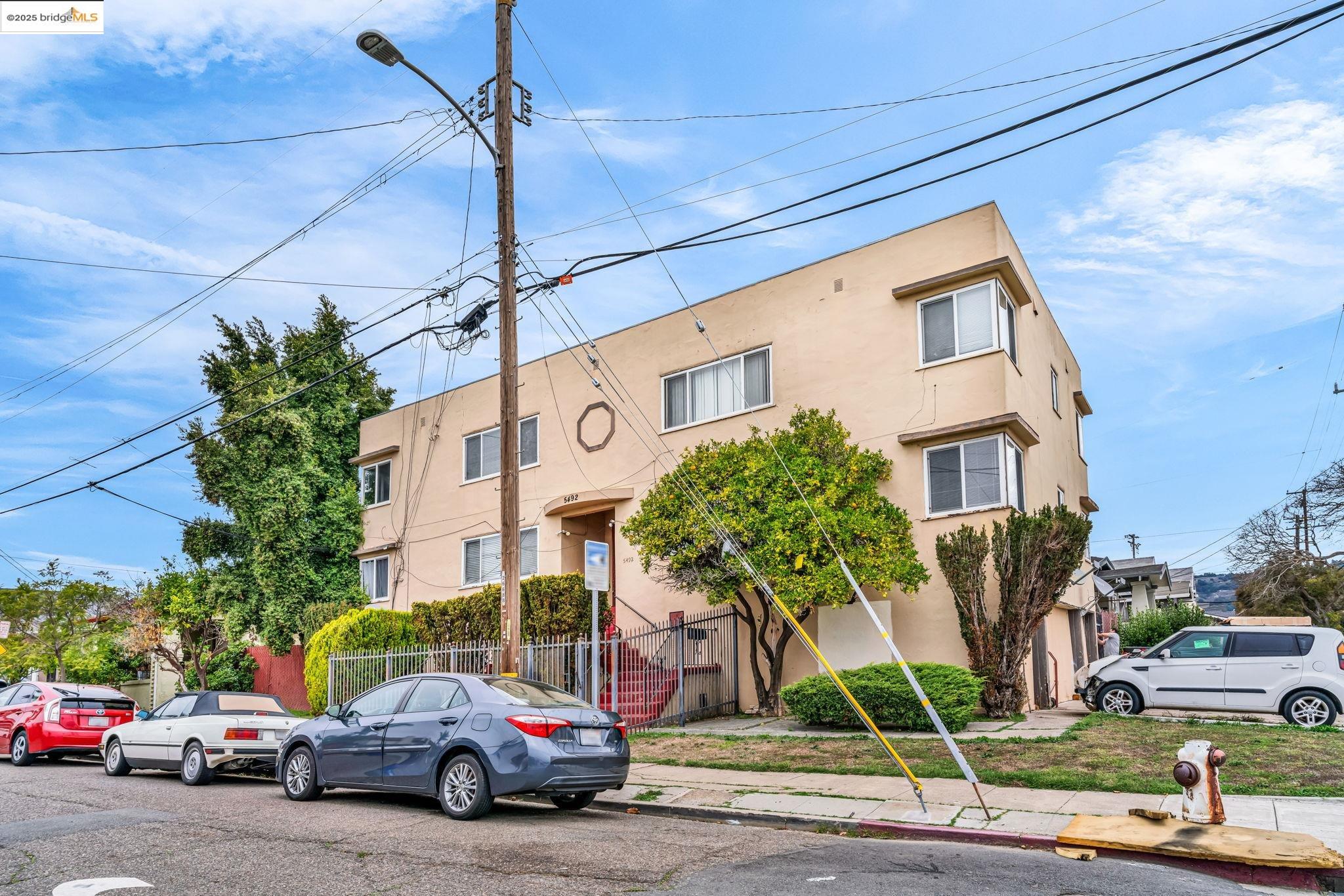 5492 Ruth Avenue Oakland, CA 94601 - Photo 2 of 16 a couple of cars parked in front of a building