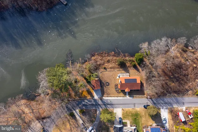 an aerial view of a house with a lake view