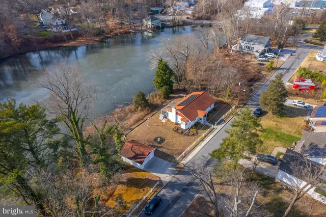an aerial view of a houses with outdoor space
