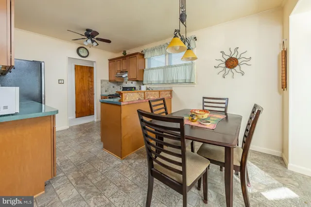 a living room with a fireplace and a flat screen tv