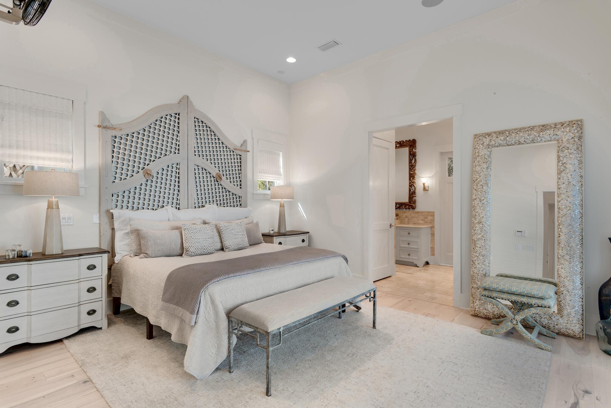 44 Tidepool Lane Watersound, FL 32461 - Photo 13 of 34 a bedroom with a bed and a table in it