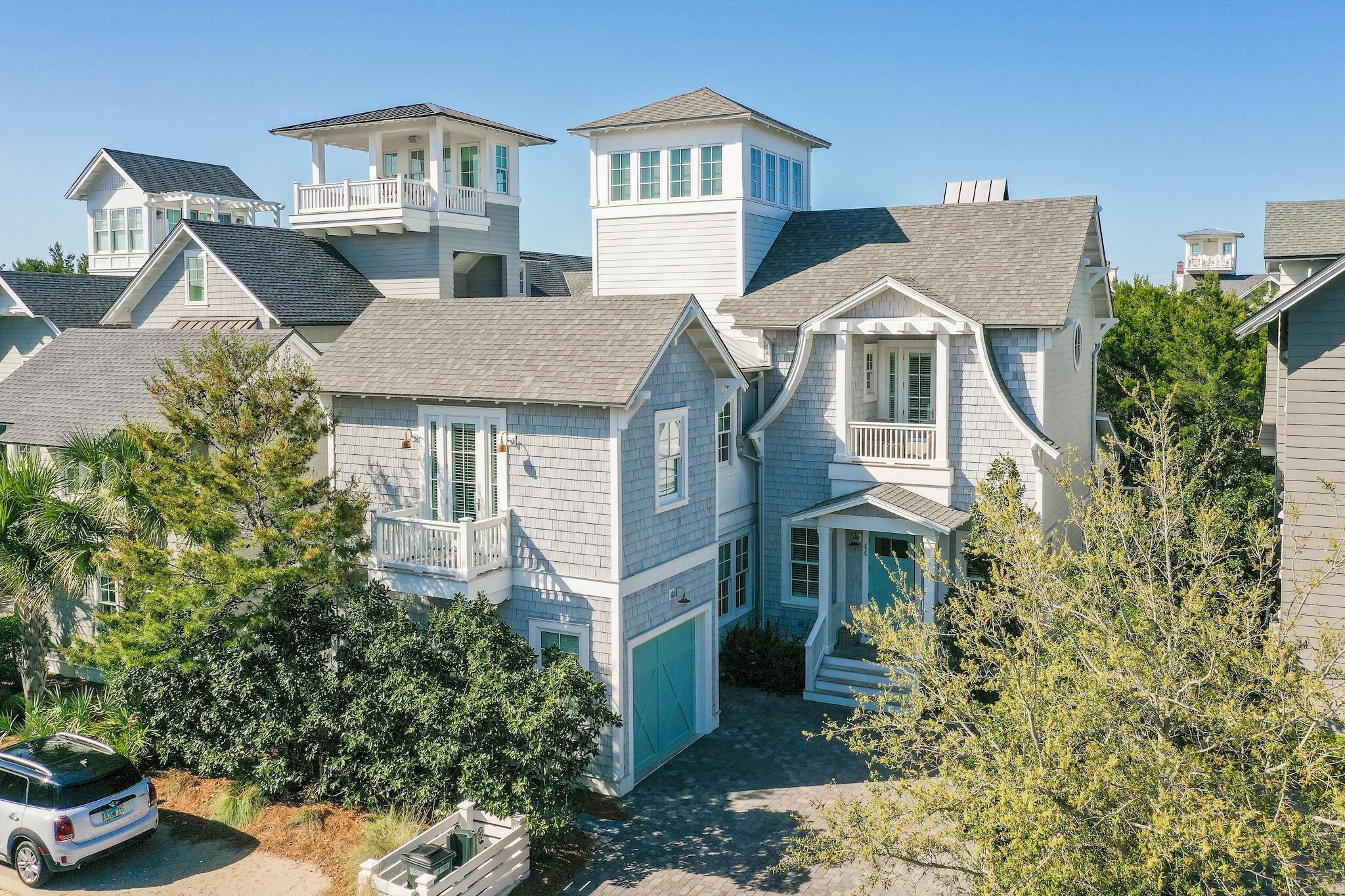 44 Tidepool Lane Watersound, FL 32461 - Photo 2 of 34 a front view of a house with a yard and garage