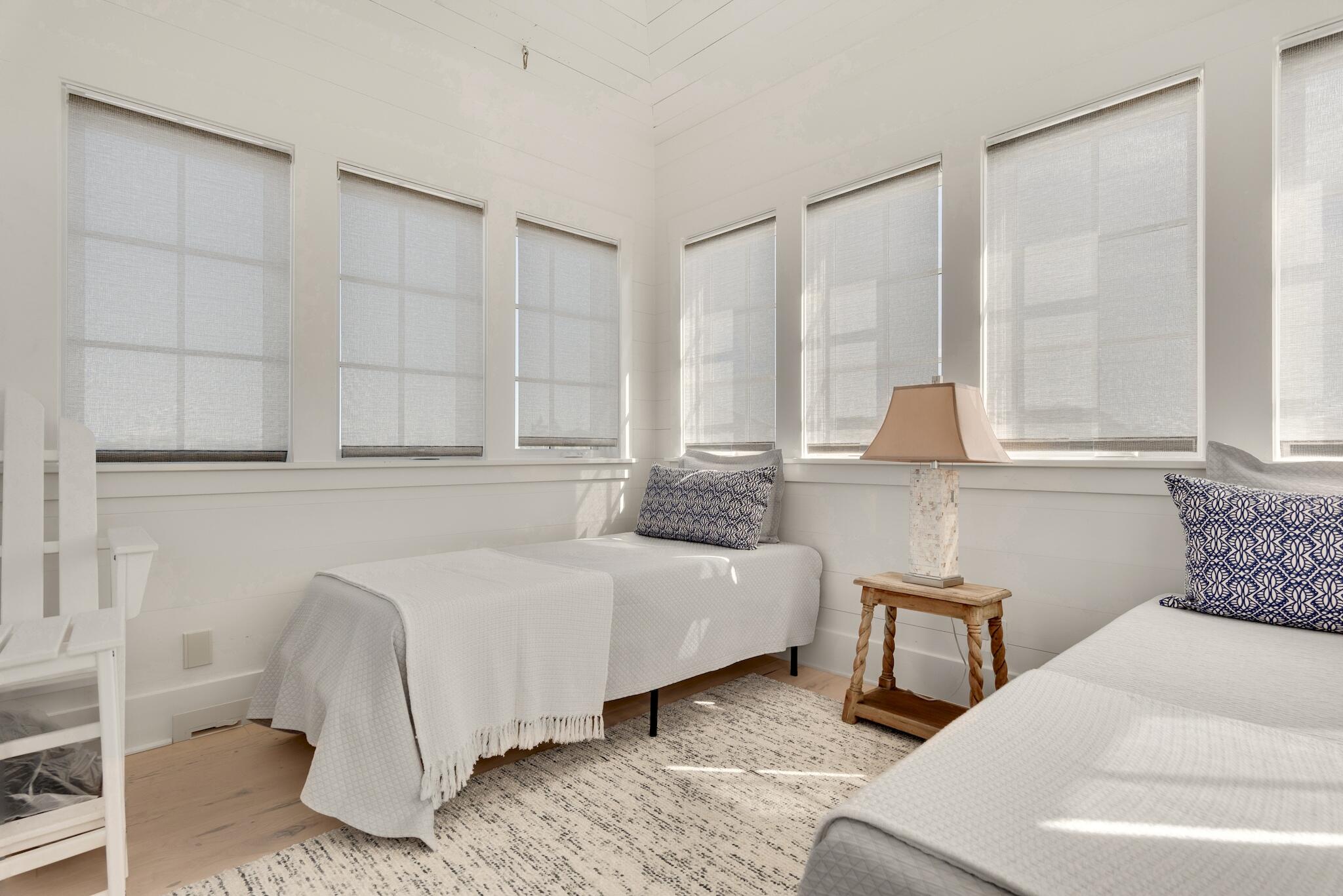 44 Tidepool Lane Watersound, FL 32461 - Photo 24 of 34 a bedroom with a bed and window