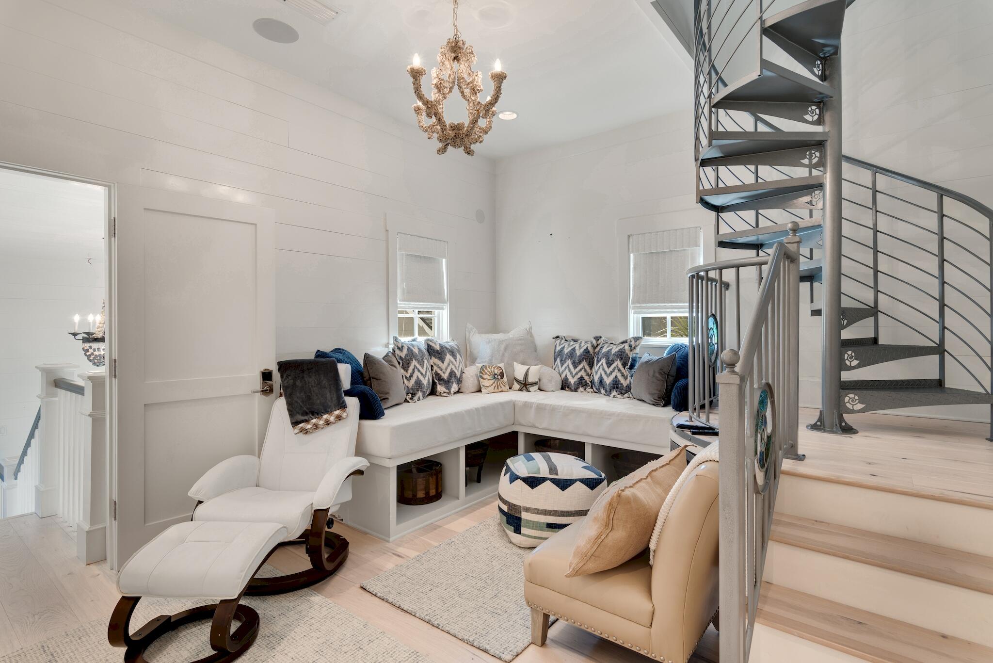 44 Tidepool Lane Watersound, FL 32461 - Photo 25 of 34 a living room with furniture and a chandelier