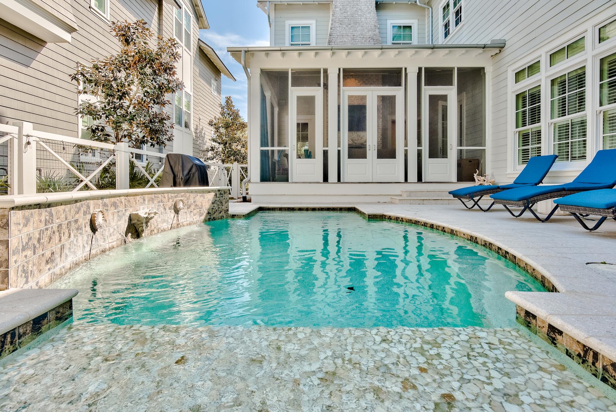 44 Tidepool Lane Watersound, FL 32461 - Photo 30 of 34 a swimming pool with outdoor seating