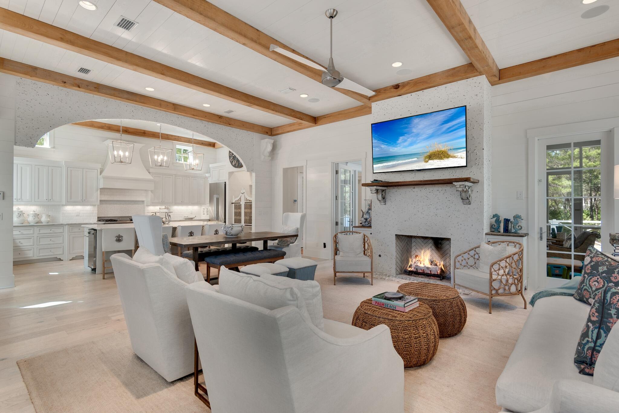44 Tidepool Lane Watersound, FL 32461 - Photo 5 of 34 a living room with furniture a fireplace and a flat screen tv