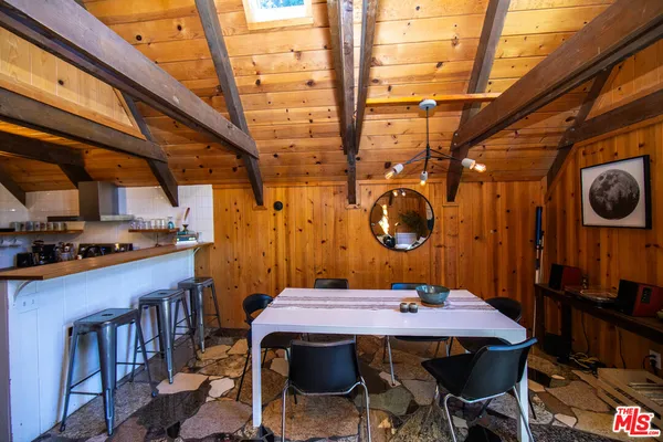a kitchen with stainless steel appliances granite countertop a sink a stove and cabinets