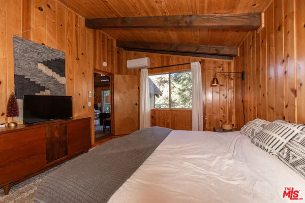 a bathroom with a toilet a sink and a mirror