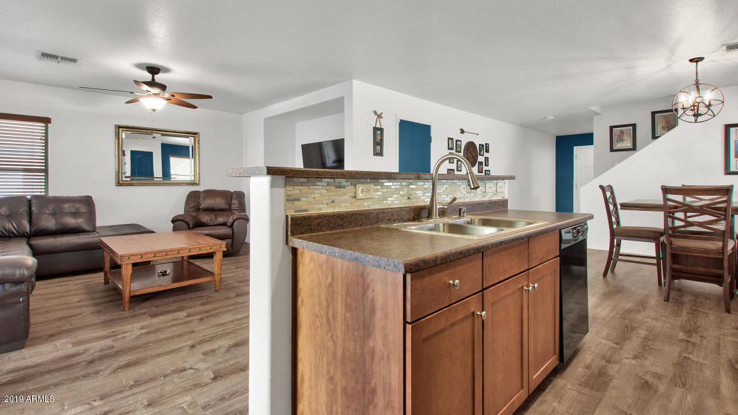 6434 West Harwell Road Laveen, AZ 85339 - Photo 9 of 19 kitchen view into living room