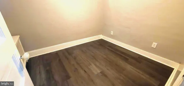 a view of a small space with wooden floor