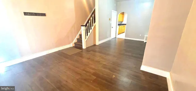 a view of an entryway with wooden floor