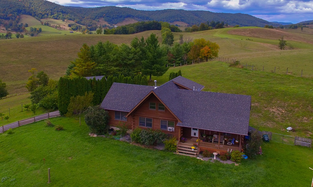 770 Hardscrabble Road Blue Grass, VA 24413 - Photo 3 of 26 a aerial view of a house with garden and outdoor space