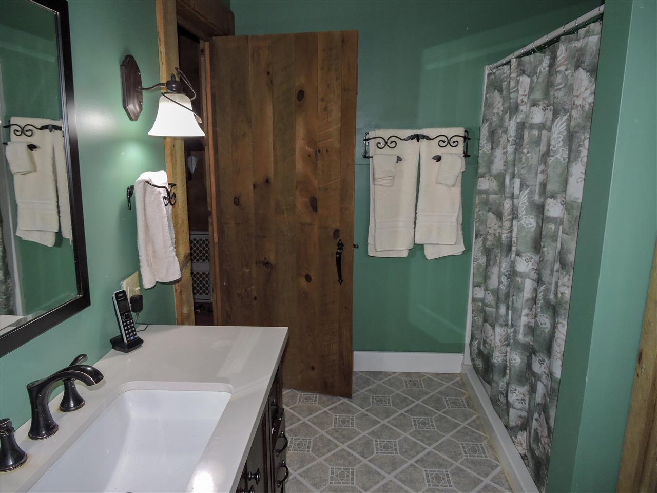 770 Hardscrabble Road Blue Grass, VA 24413 - Photo 8 of 26 a bathroom with a sink and a mirror