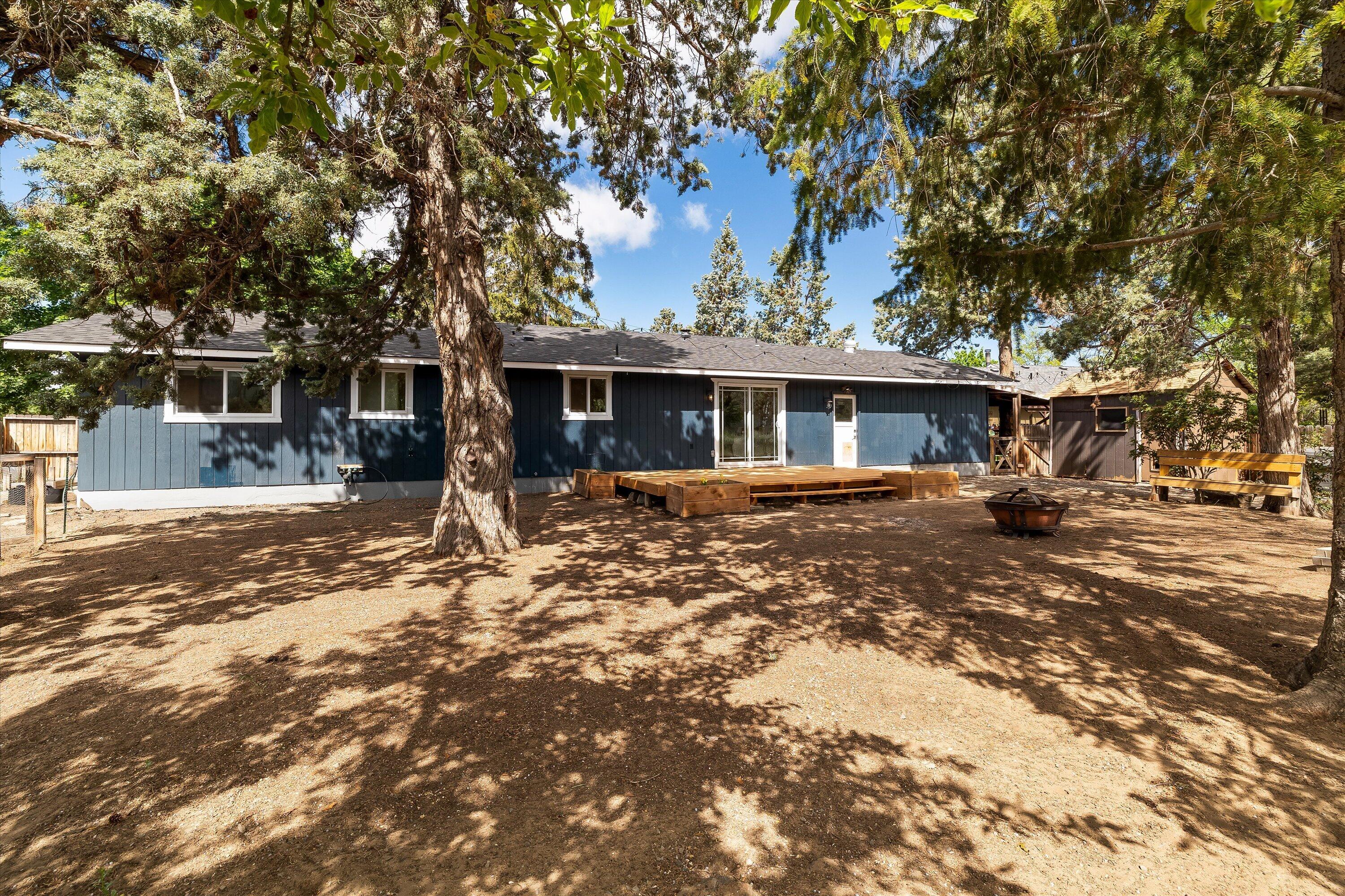 63634 Hunters Circle Bend, OR 97701 - Photo 21 of 28 a front view of a house with a yard