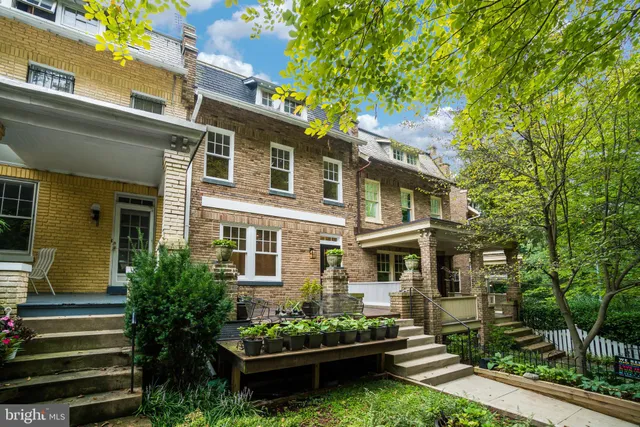 front view of a house with a garden